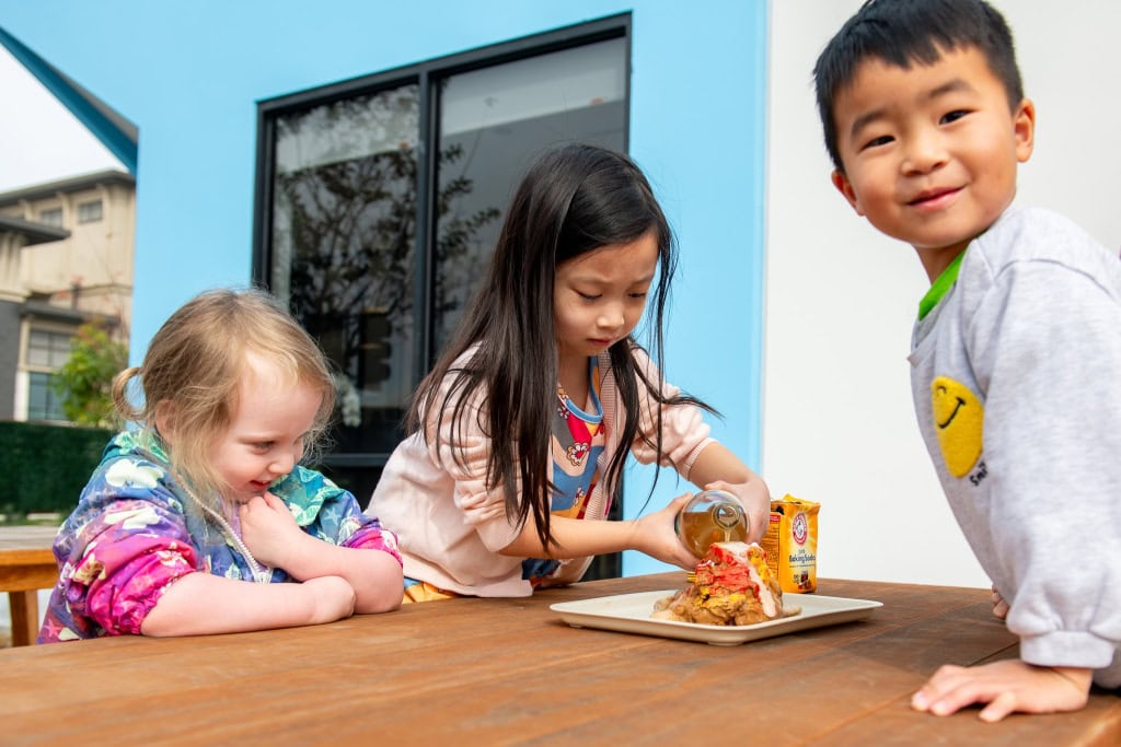 DSC_9503 Diverse group of preschool children collaborating in a classroom setting at Westcliff Early Learning Academy encouraging enrollment