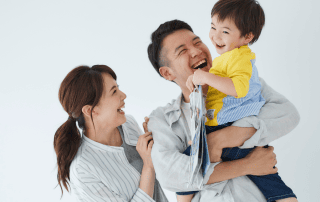 The Language of Connection: How Thoughtful Communication Shapes Your Child’s World. The image of a family