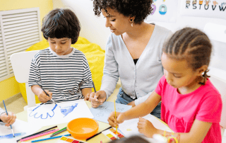 Children exploring creativity through painting as part of STEAM learning at Westcliff Early Learning Academy in Irvine.